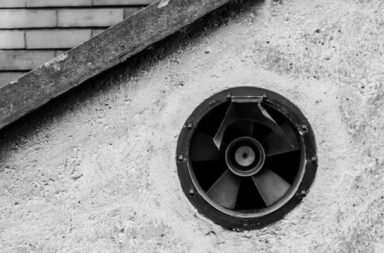 black 5 spoke wheel on concrete wall