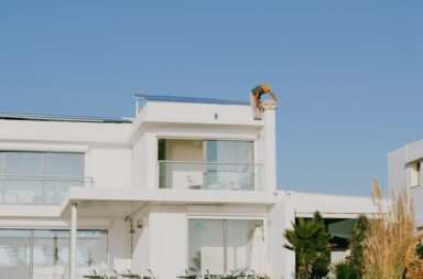 a large white house sitting on top of a hill